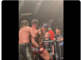 Seth Rollins Interact With A Fan At Ringside